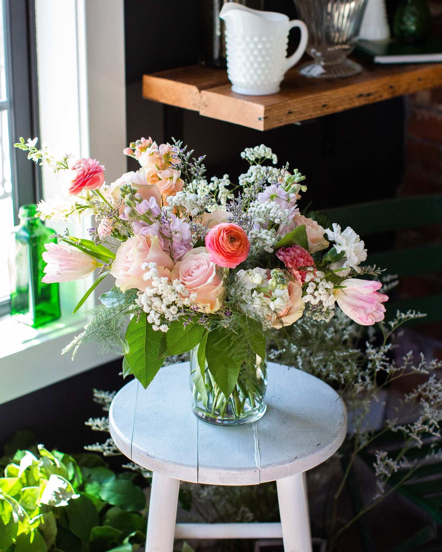 A stunning visual of the 'From the Garden' flower arrangement by Cassidy Flower Co. This vibrant bouquet features a delightful mix of freshly picked blooms, showcasing a harmonious blend of colors and textures. The arrangement exudes natural elegance, with a focus on locally sourced, garden-fresh flowers. Each petal and leaf is artfully arranged, creating a visually pleasing composition that embodies the beauty of nature. A perfect choice to bring the charm of a blossoming garden into any space.