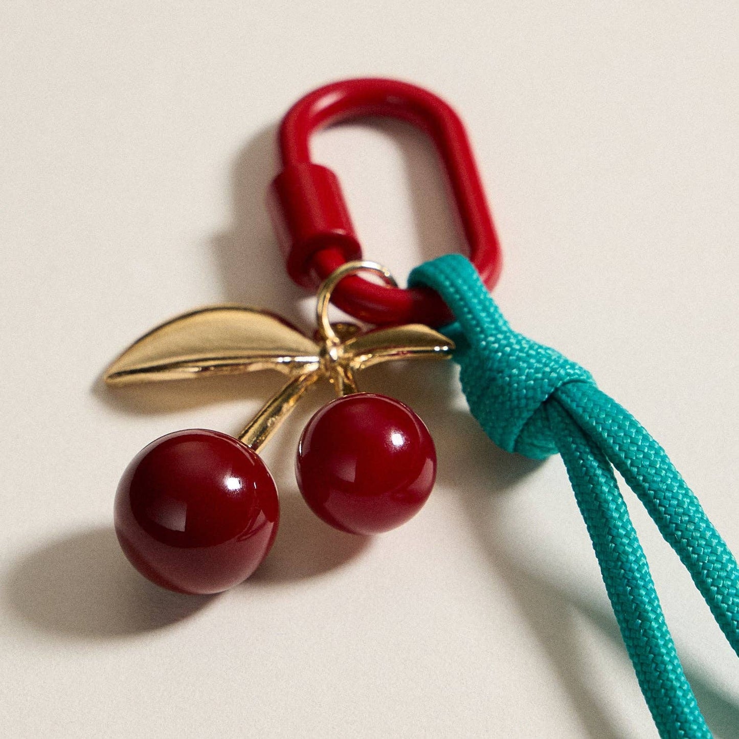Gold-Tone Cherry Enamel Keychain | Braided Rope Detail